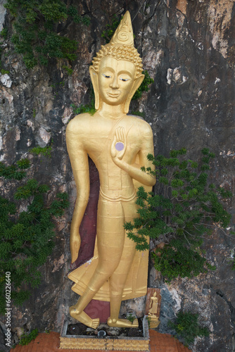 Phra Buddha Wichitman It is a large Buddha image, outdoors, which can be seen from the road passing by. Located at Tham Ruesi Khao Ngu Temple. Located at Ratchaburi Province in Thailand. photo