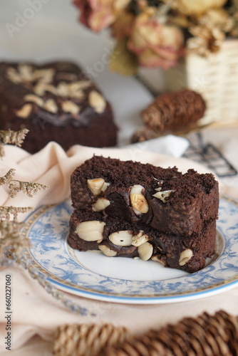 Decadent Black and Brown Brownies with a Generous Almond Topping - Irresistible Dessert Temptation