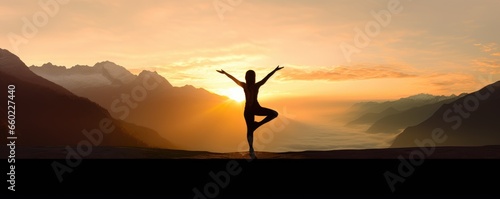 A person practicing yoga in the serene backdrop of majestic mountains