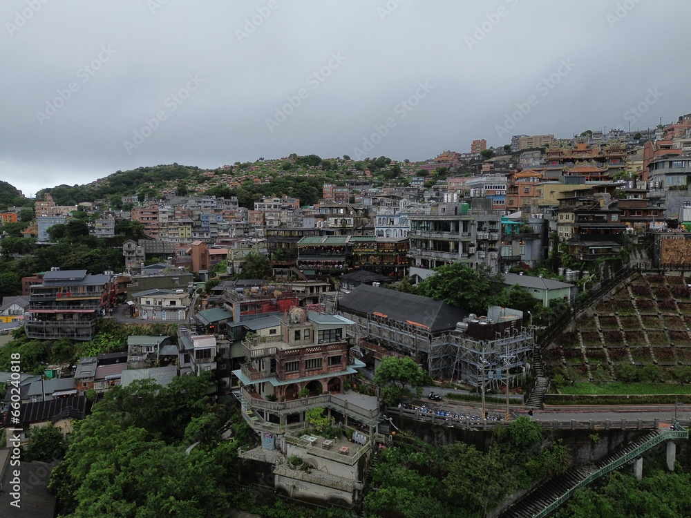 Aerial view of Jiufen Taipei by drone with clouds forming on the background. Popular spirited away district in Taiwan.