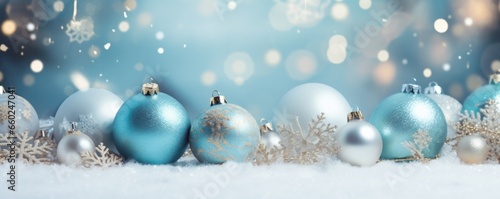 christmas background with gold and silver christmas ornaments in the snow