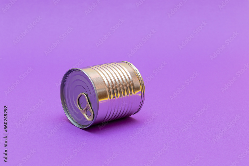 Unopened Tin Can with Blank Edge on Violet Background. Canned Food. Aluminum Can for Safe and Long Term Storage of Food. Steel Sealed Food Storage Container Unopened Tin Can with Blank Edge on Violet Background. Canned Food. Aluminum Can for Safe and Long Term Storage of Food. Steel Sealed Food Storage Container