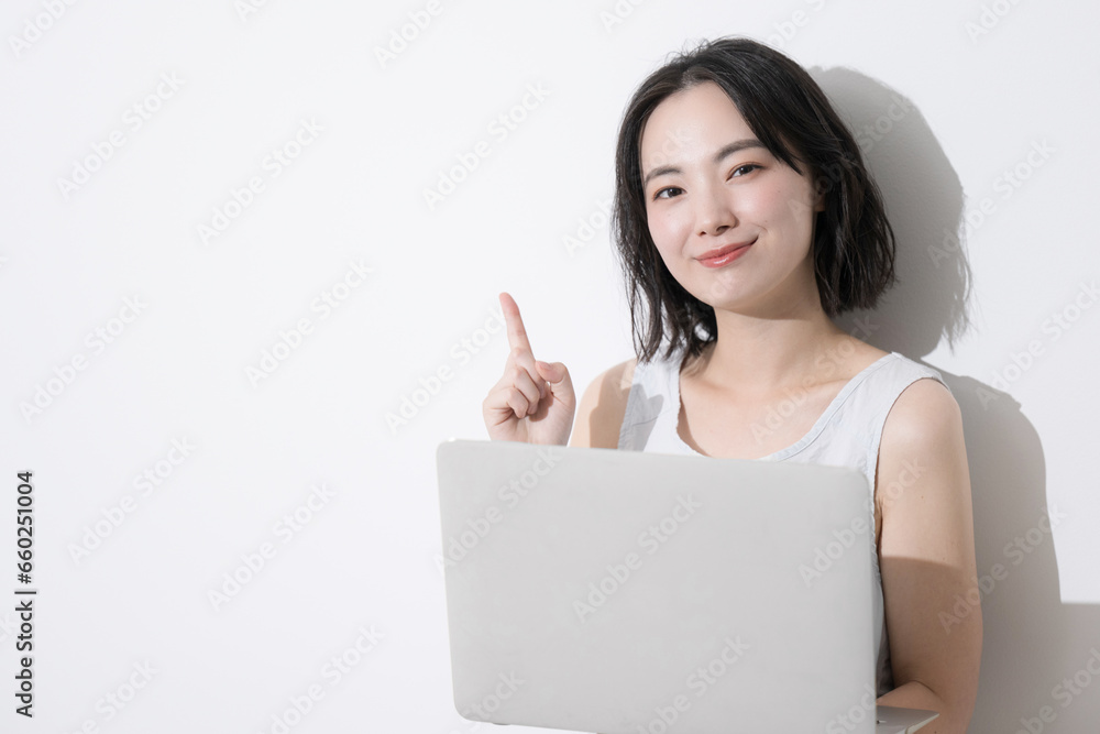 Woman using a computer Woman pointing and making a recommended pose Woman using a computer Woman pointing and making a recommended pose