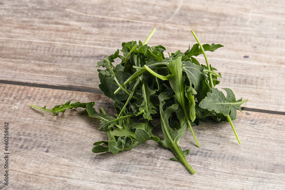 Green Arugula heap over background Green Arugula heap over background