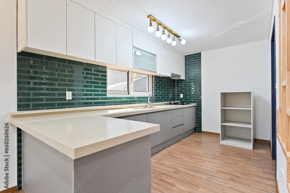 Fotografie The L-shaped kitchen is convenient for cooking