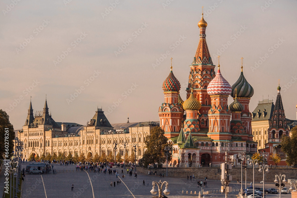 MOSCOW, RUSSIA - SEPTEMBER 26, 2023: St. Basil's Cathedral on Vasilievsky Descent on Red Square on a sunny autumn evening against a bright blue sky. A popular tourist attraction in Moscow.