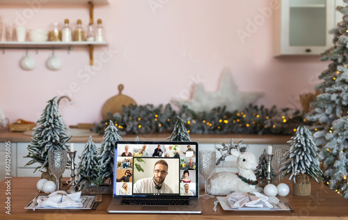 Family video call by remote chat laptop computer screen on Christmas holiday background. Xmas online virtual family party celebration, Happy New Year videocall.