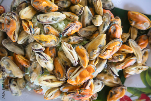 Boiled shellfish  and Cockle eaten with seafood dipping sauce is a famous food in Thailand