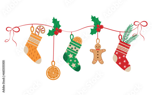 Christmas stockings with traditional holiday decorations, decorative oranges, gingerbread man. Hanging knitted socks with Christmas patterns on a rope. Socks with stars, snowflakes.