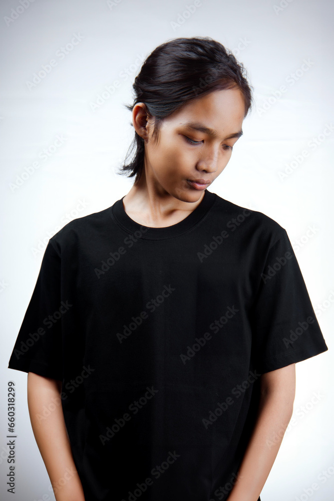 Asian men. Young Asian man close up shot isolated on white. Young Asian man wearing a plain black t-shirt isolated on a white background.