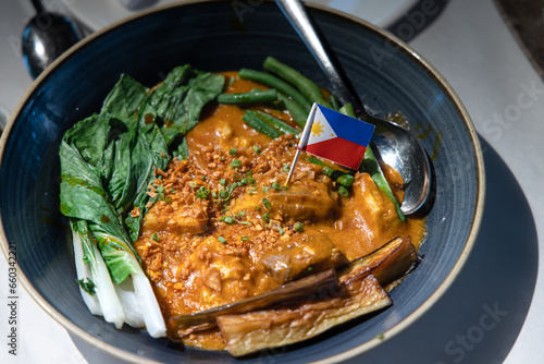 Kare-kare is a Philippine stew that features a thick savory peanut sauce.