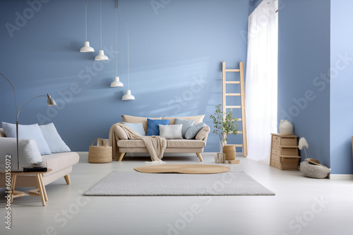 Modern living room with beige, white and blue colors. Minimalistic cozy design with sofa