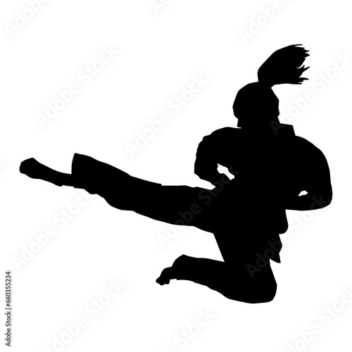 Fototapeta Naklejka Na Ścianę i Meble -  Silhouette of a woman kicking pose. Silhouette of a female martial art in action pose.