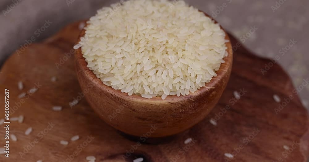 a large amount of uncooked fresh polished rice , uncooked dry rice used in cooking a large amount of uncooked fresh polished rice , uncooked dry rice used in cooking