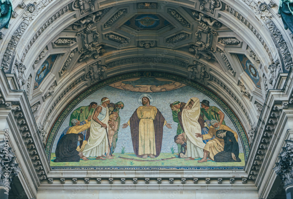 detail of catholic fresco with religious moment represented on german cathedral facade 