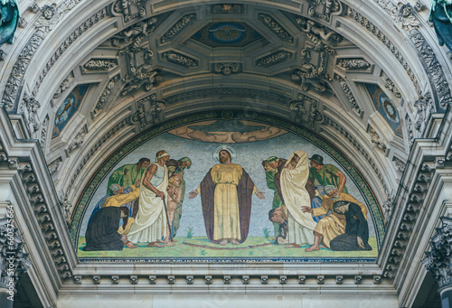 detail of catholic fresco with religious moment represented on german cathedral facade 