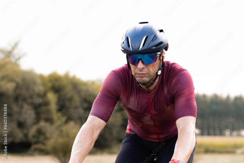 Detail shot of the legs of a cyclist riding a bike in the countryside. Detail shot of the legs of a cyclist riding a bike in the countryside.