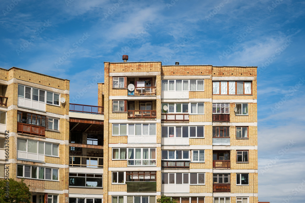 Bright brick apartments building with flat windows in visaginas lithuania