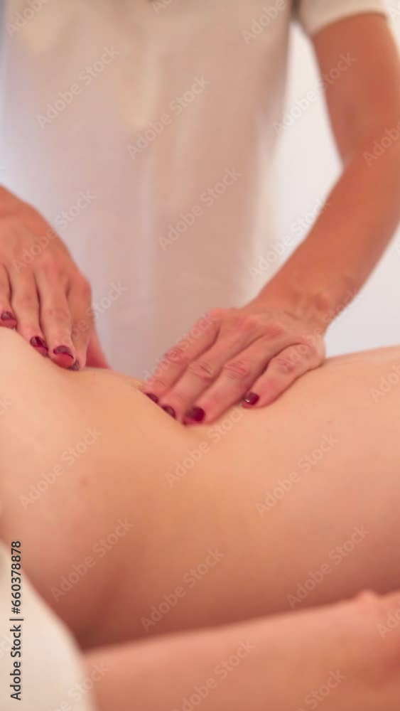 Osteopath massaging woman back on an ayurveda treatment to relax muscles and nerves Osteopath massaging woman back on an ayurveda treatment to relax muscles and nerves