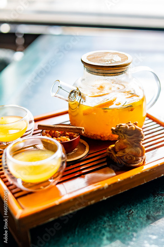 tea pot and Cup of sea buckthorn tea