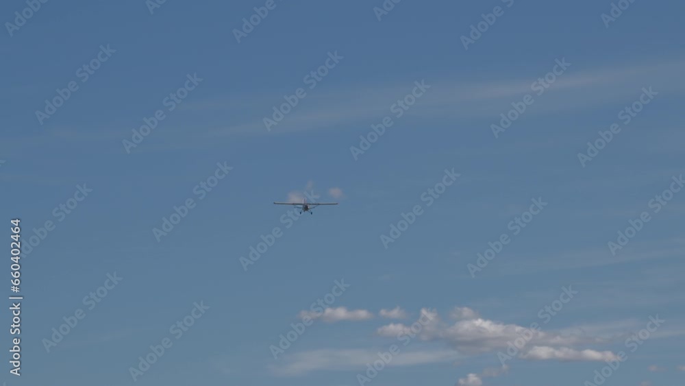 Small propeller airplane flying in the blue sky Small propeller airplane flying in the blue sky