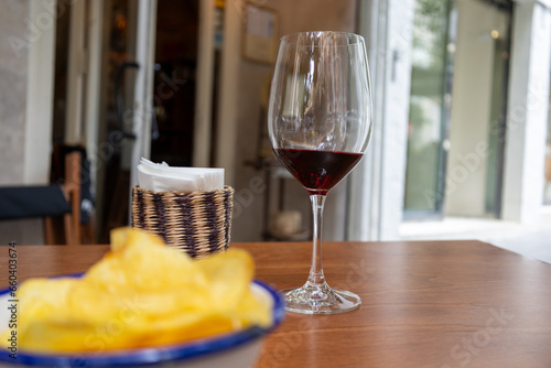 aperitif on the terrace with a glass of wine and chips