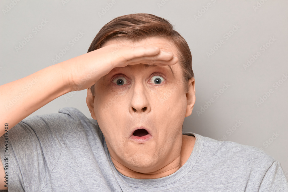 Portrait of surprised impressed man gazing into the distance Portrait of surprised impressed man gazing into the distance