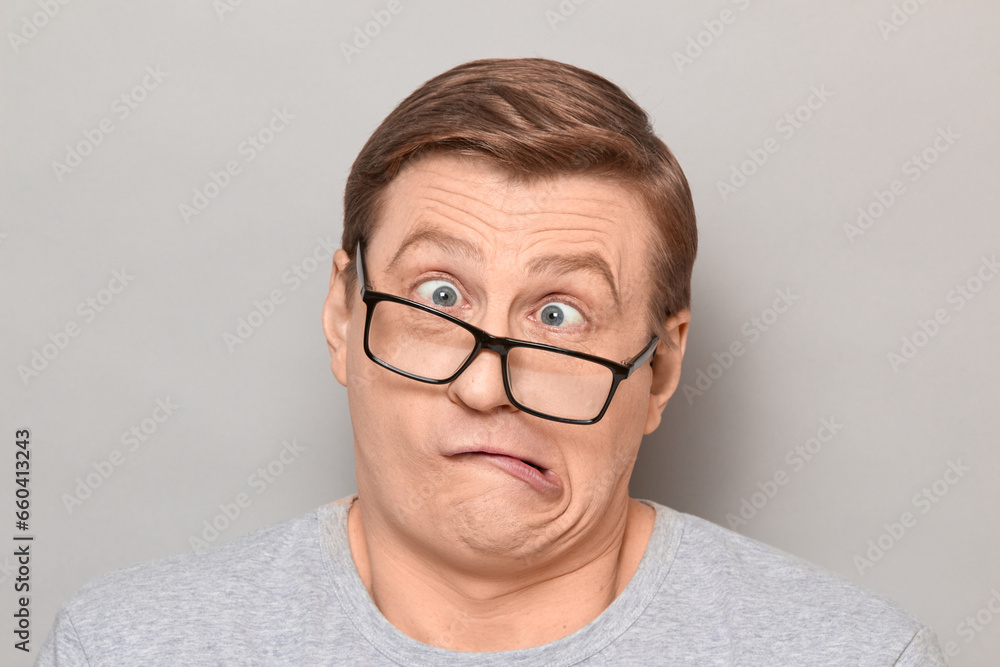 Portrait of funny weird mature man making goofy crazy face Portrait of funny weird mature man making goofy crazy face