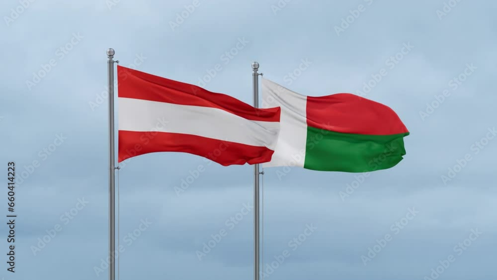 Madagascar flag and Austria flag waving together on cloudy sky, endless seamless loop, two country relations concept Madagascar flag and Austria flag waving together on cloudy sky, endless seamless loop, two country relations concept