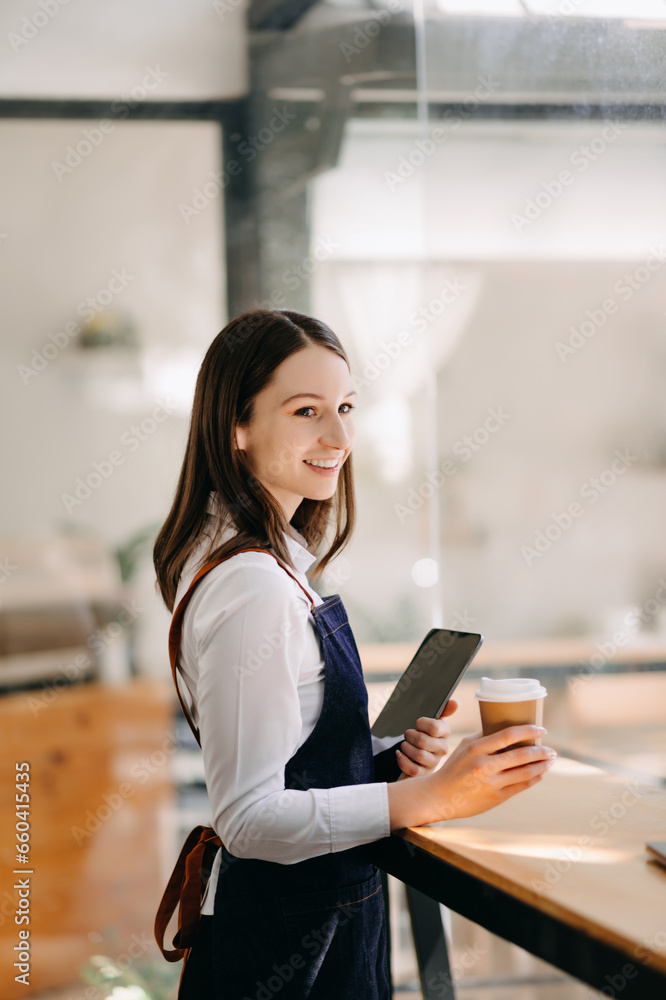 Startup successful small business owner sme woman stand with tablet in cafe restaurant. . Startup successful small business owner sme woman stand with tablet in cafe restaurant. .