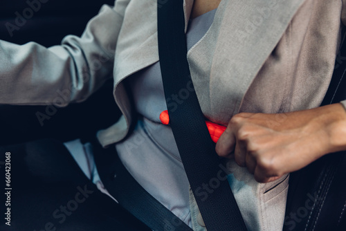 Woman use Safety Hammer and Seatbelt Cutter in Cars, Cut belt When emergency. In case of emergency on car safety red hammers to Cut the belt. 