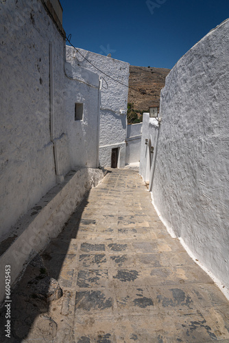 Charming Narrow Streets of Lindos: A labyrinth of whitewashed buildings and cobblestones, revealing the heart and soul of Rhodes Island's historic gem.
