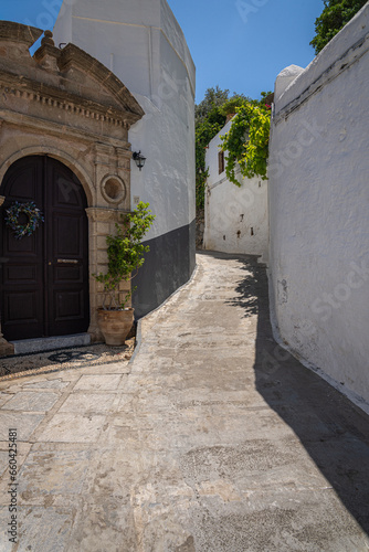 Charming Narrow Streets of Lindos: A labyrinth of whitewashed buildings and cobblestones, revealing the heart and soul of Rhodes Island's historic gem.
