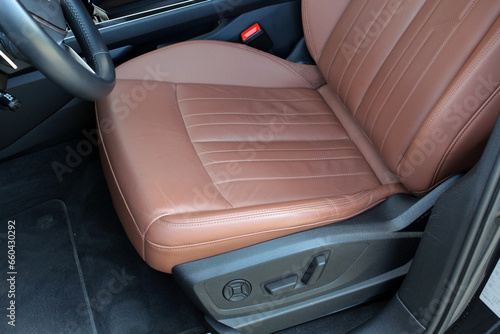 Brown leather driver seats. Interior of prestige car. Comfortable perforated leather seats. Modern luxury car brown leather interior. © Best Auto Photo