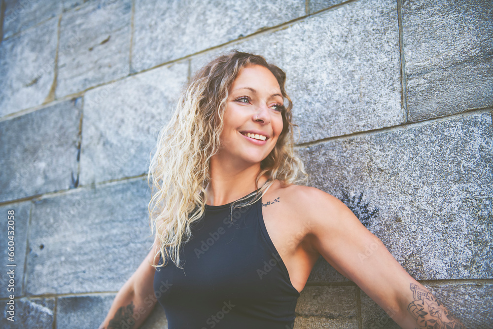 portrait caucasian woman with fresh and clean skin stands outside on industrial background portrait caucasian woman with fresh and clean skin stands outside on industrial background