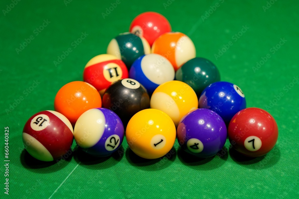 Closeup of a vibrant array of pool balls are arranged in a classic triangle formation, Closeup of a vibrant array of pool balls are arranged in a classic triangle formation,
