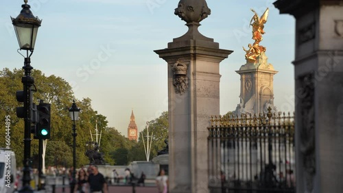 Victoria Memorial by Buckingham Palace and view down the Mall to Big Ben.
Late afternoon sun illuminates the gold statue commemorating Queen Victoria and, in the distance, Big Ben.