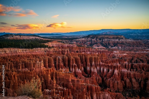 Picturesque landscape featuring the setting sun behind a Bryce Canyon, Utah