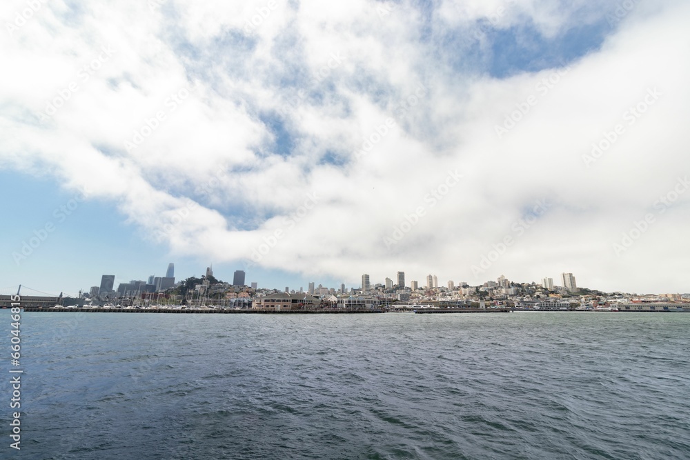 Fototapeta premium Aerial view of the city of San Francisco with the body of water in the foreground