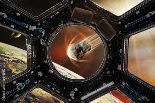 Fototapeta Naklejka Na Ścianę i Meble -  Earth planet and asteroid in spaceship porthole. Meteorite at the Earth planet orbit. Science fiction art. Elements of this image furnished by NASA.