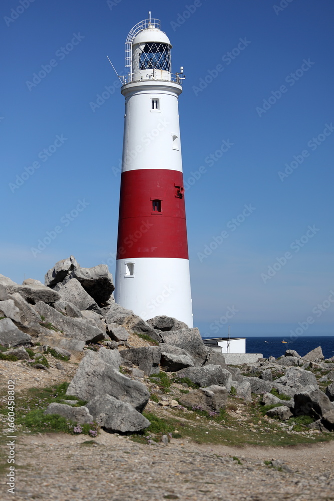 Vertical photo of the lighthouse at Portland Bill near Weymouth on the Jurassic Coast in Dorset, England.
