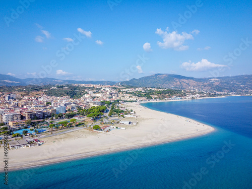 Soverato Italy drone shot of the coastline and the city with the mountains in the background