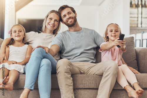 Home, watching tv and family with girls on a sofa, relax and happiness with fun, movies and support on a weekend break. Children, mother and father with kids, films and series with care and cheerful