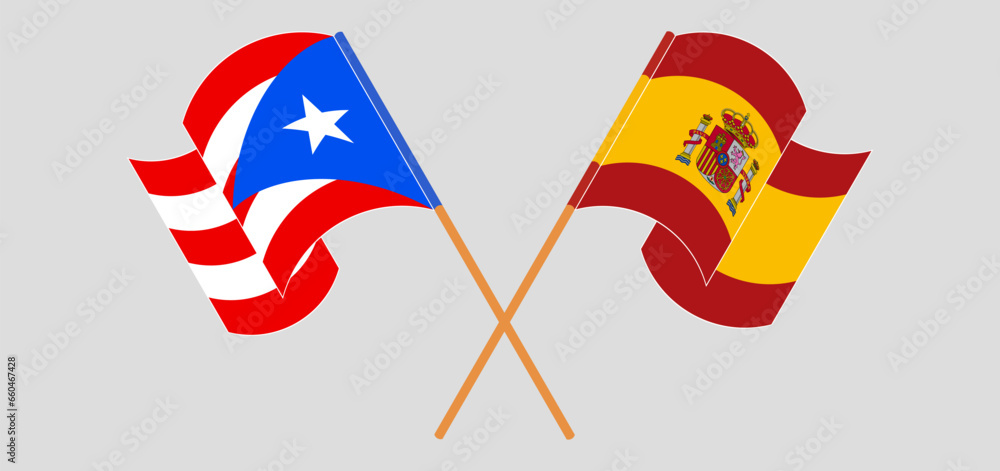 Crossed and waving flags of Puerto Rico and Spain