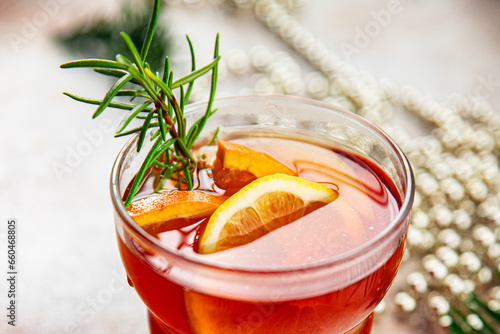 christmas mulled wine cocktail citrus and rosemary traditional drink new year holiday appetizer meal food snack on the table copy space food background rustic top view photo