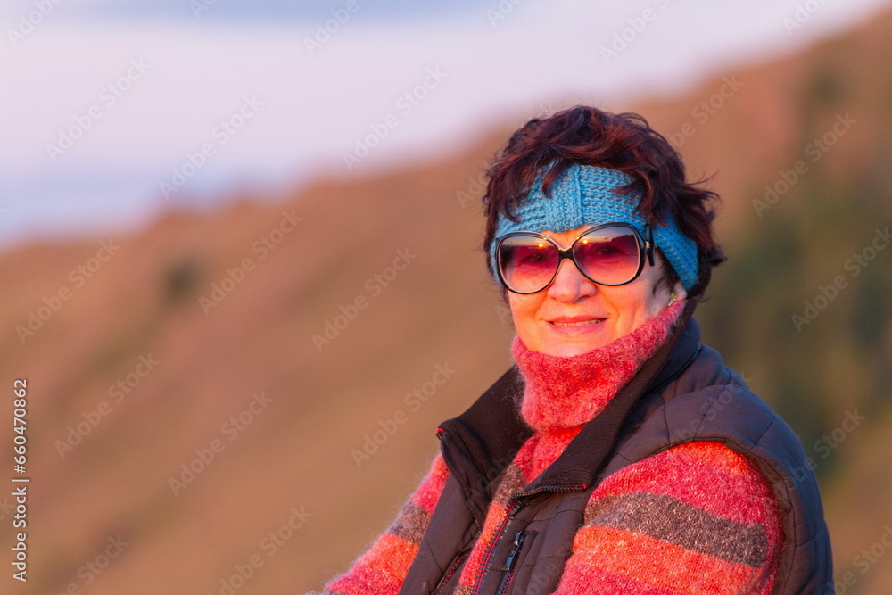 a beautiful mature woman meets the dawn on the Nurali ridge in the southern Urals in Bashkortostan a beautiful mature woman meets the dawn on the Nurali ridge in the southern Urals in Bashkortostan