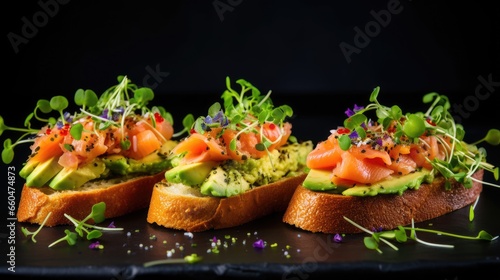 Top view of healthy seafood open sandwiches with salted salmon guacamole avocado and microgreens