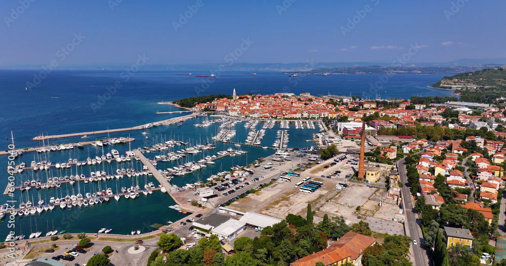 Aerial view of the old fishing town, Izola, on an impressive summer day in Slovenia, Europe. Beautiful seascape of the Adriatic Sea