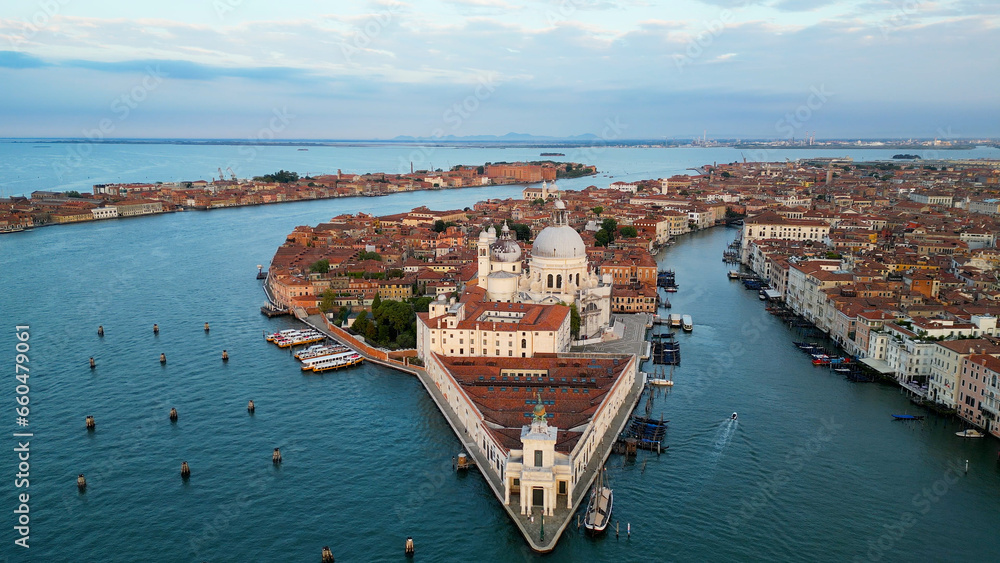 Venice Italy skyline, aerial view of Basilica di Santa Maria della Salute and Grand Canal at sunrise