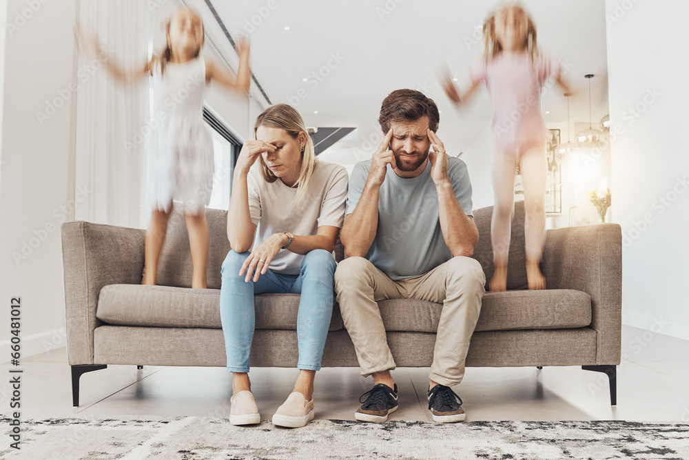 Naklejka premium Frustrated parents, sofa and headache with children jumping in living room chaos, ADHD or crazy home. Mother and father in stress, burnout or fatigue with busy or hyper active kids in lounge at house
